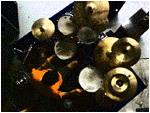kurt warming up his drum set as my friends Baked Human Beans gets ready to practice in their north plymouth rehearsal space a couple weeks ago, and high above on the wooden loft I leaned forward, image snapping.
