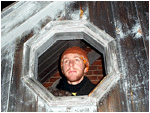  jeremy, home form school, peeking out of a wooden stairwell attached to one of cordage park's old abandoned factory buildings 